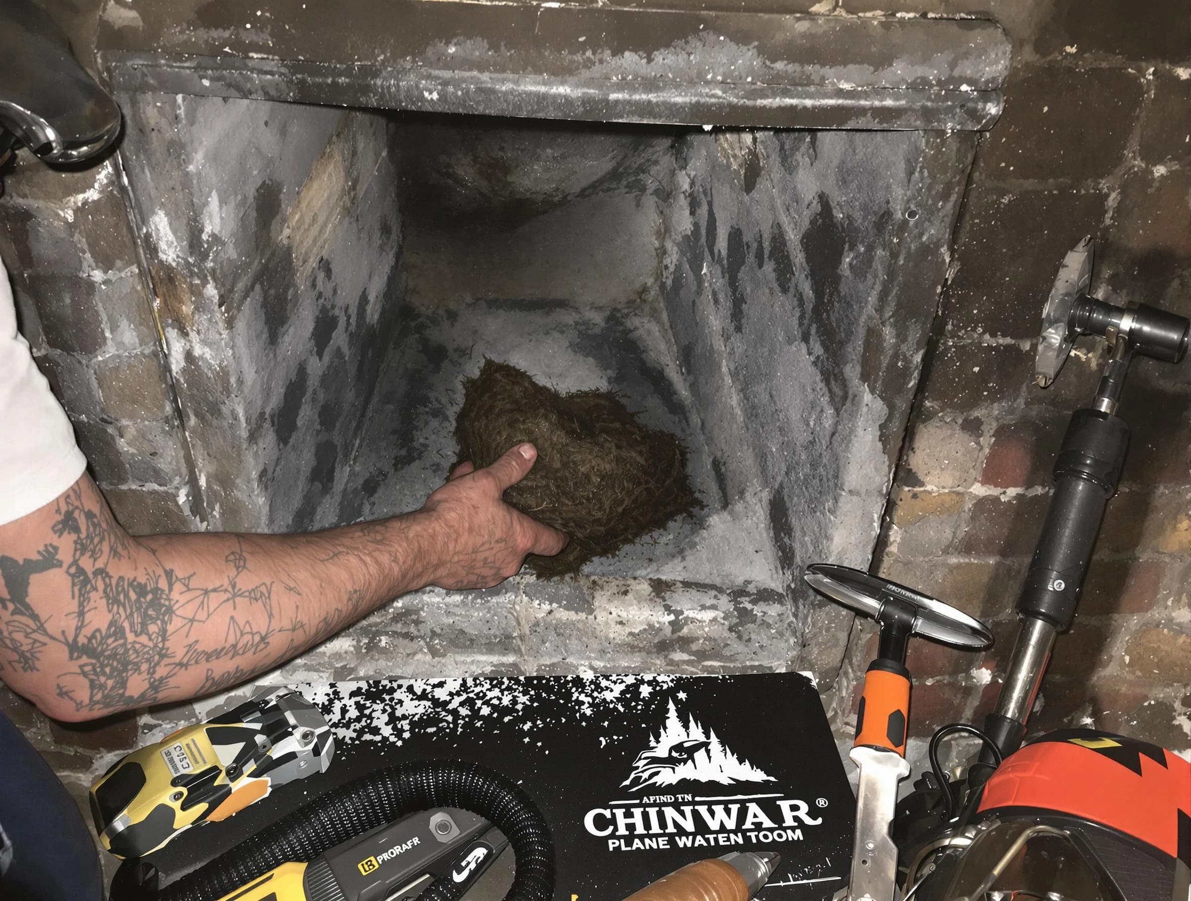Sandy Springs Chimney Sweep safely removing debris and screening chimney in Sandy Springs, GA