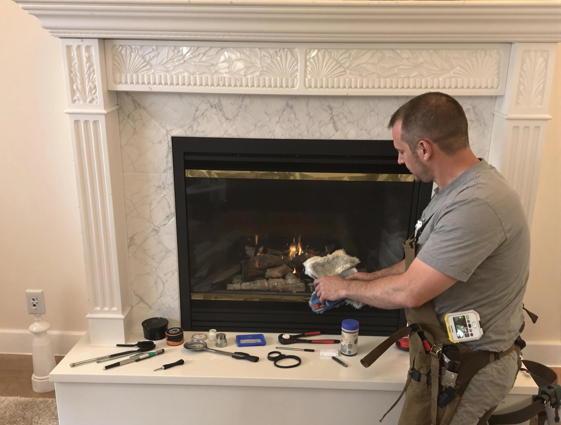 Sandy Springs Chimney Sweep performing fireplace maintenance in Sandy Springs, GA